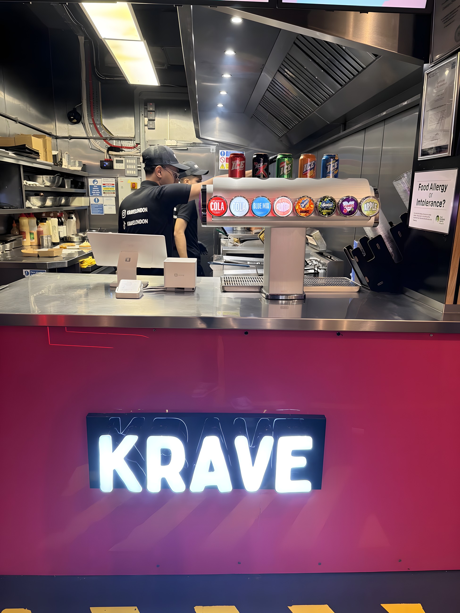 The KRAVE counter in Mile End with the illuminated KRAVE sign and drinks fountain
